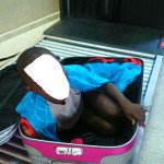 Sub-Saharian immigrant aged eight years in suitcase